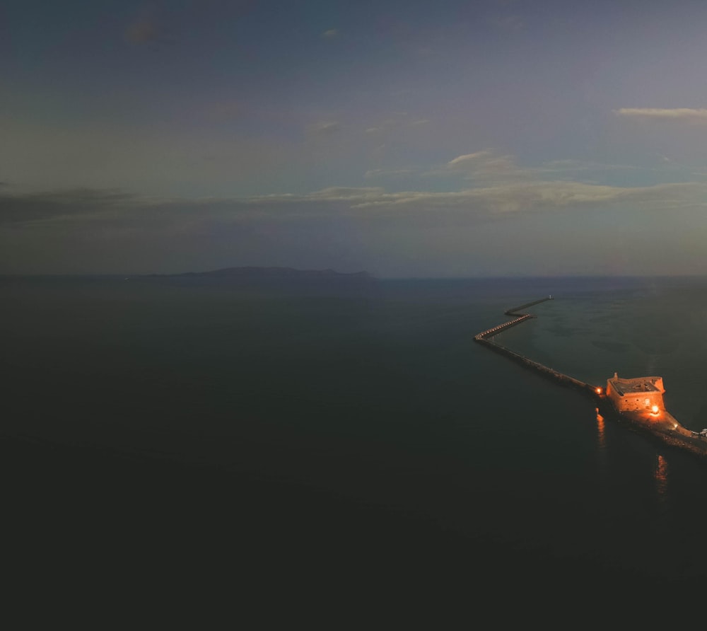 aerial view of a ship on a sea of clouds