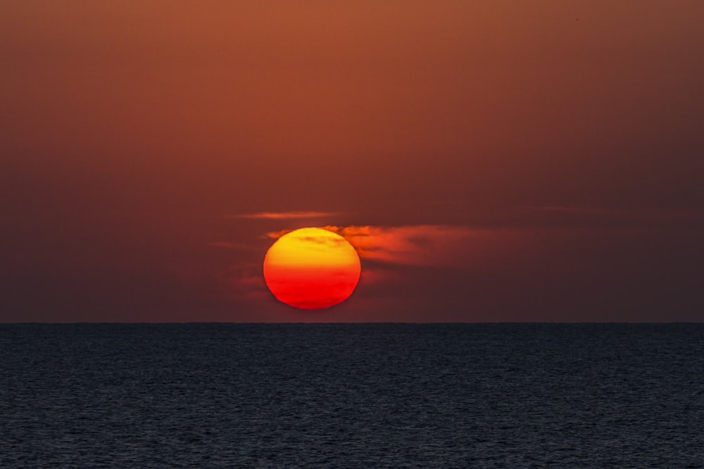 body of water during sunset