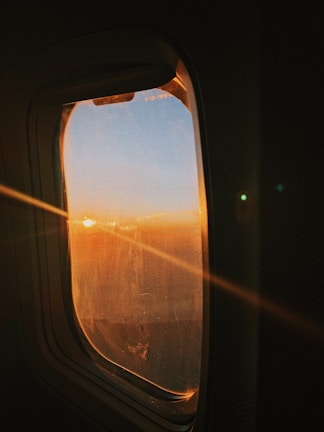 Beautiful sunset view from a private jet window.