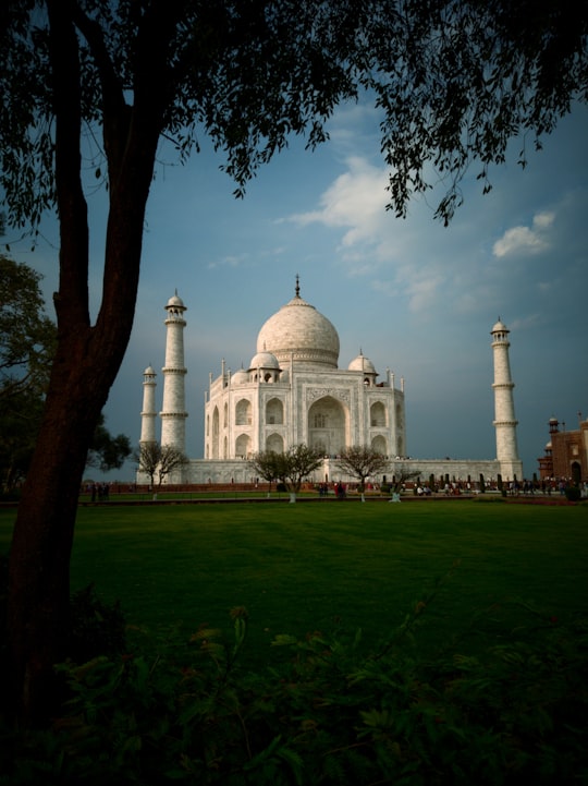 white concrete building under blue sky during daytime in Taj Mahal India