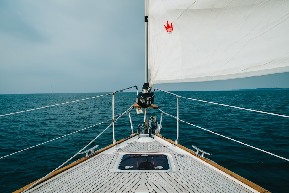 white and black boat on sea during daytime