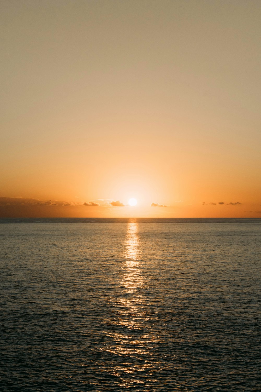 body of water during sunset