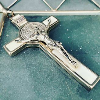 silver key on blue textile