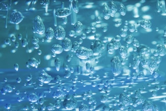 clear glass bottle lot in close up photography
