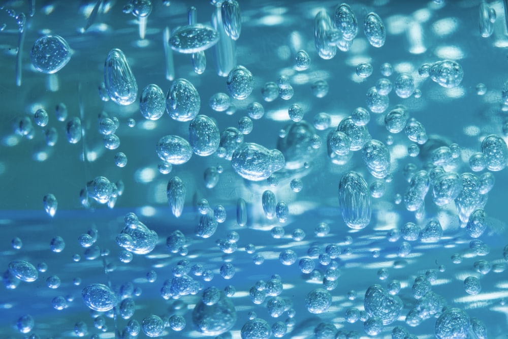 clear glass bottle lot in close up photography