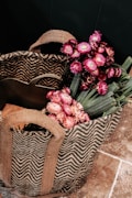 pink and white flower bouquet on brown woven basket
