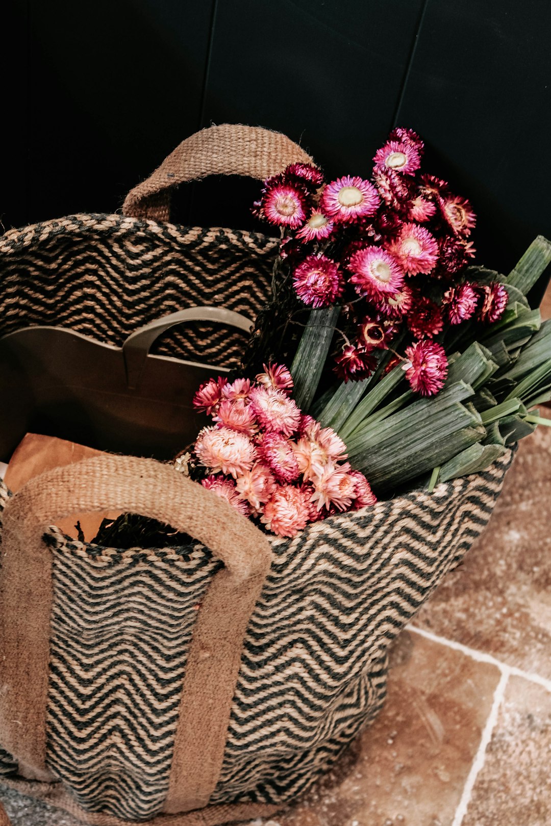 pink and white flower bouquet on brown woven basket