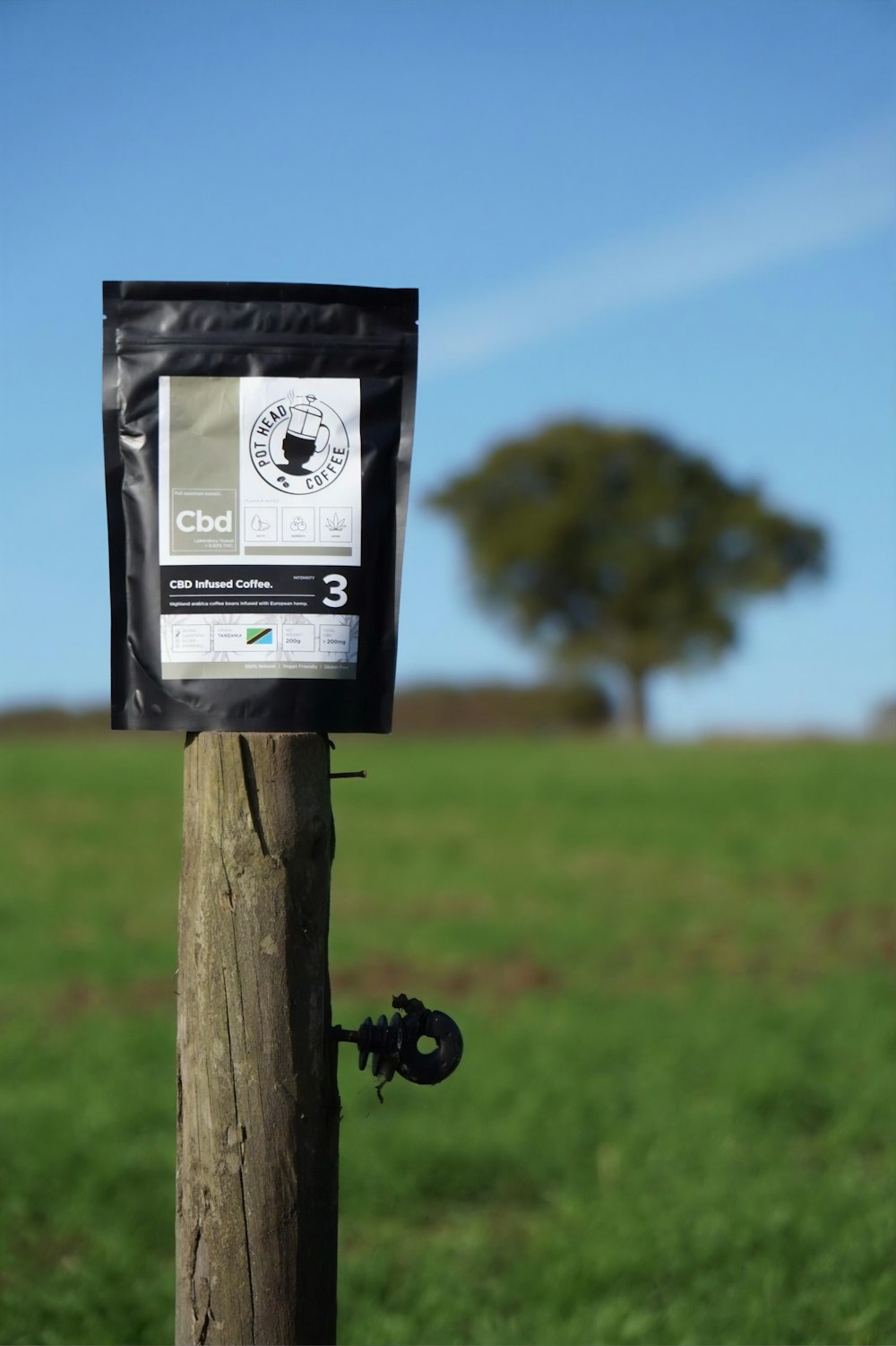 black and white box on brown wooden post