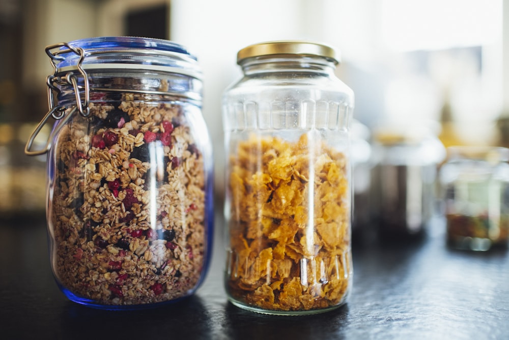 brown and black beans in clear glass jar