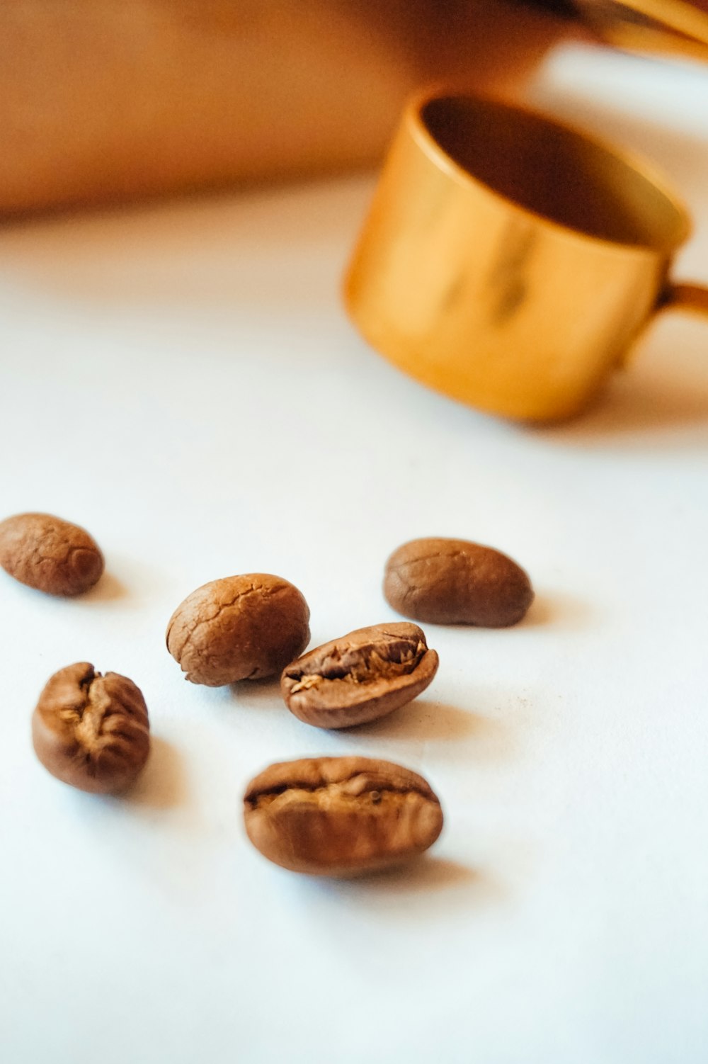 brown nuts on white surface