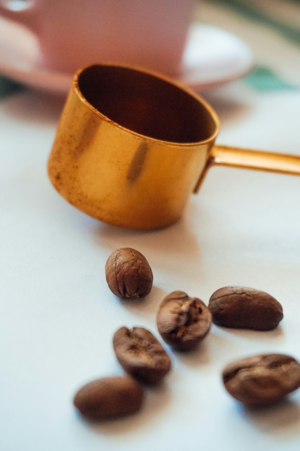 brown ceramic mug on white table