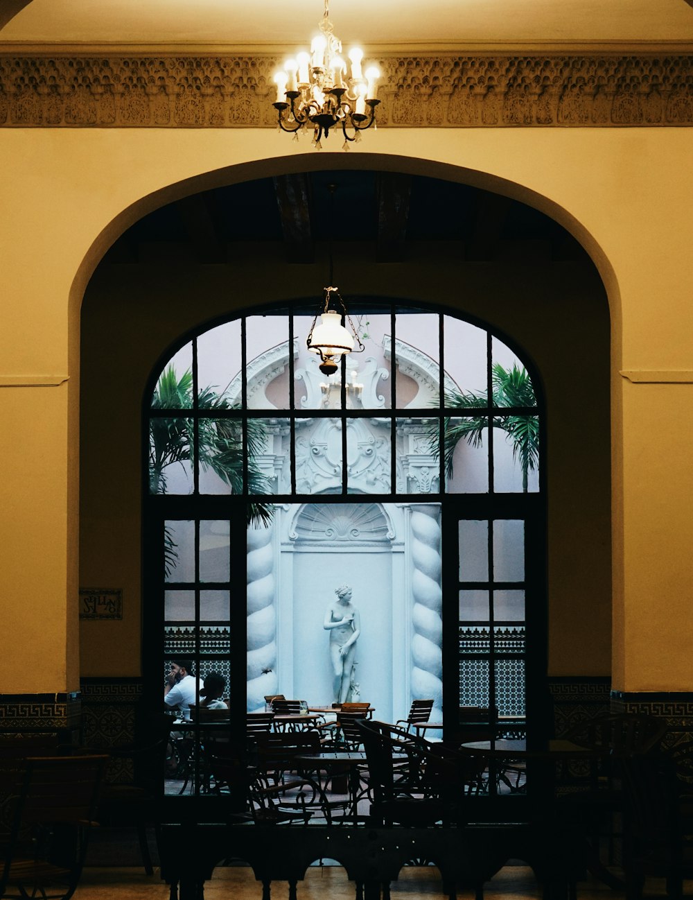 white statue on brown wooden table