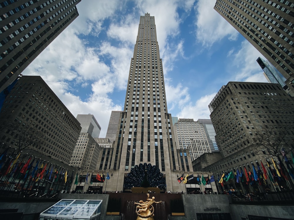 people walking on pedestrian lane near high rise buildings during daytime