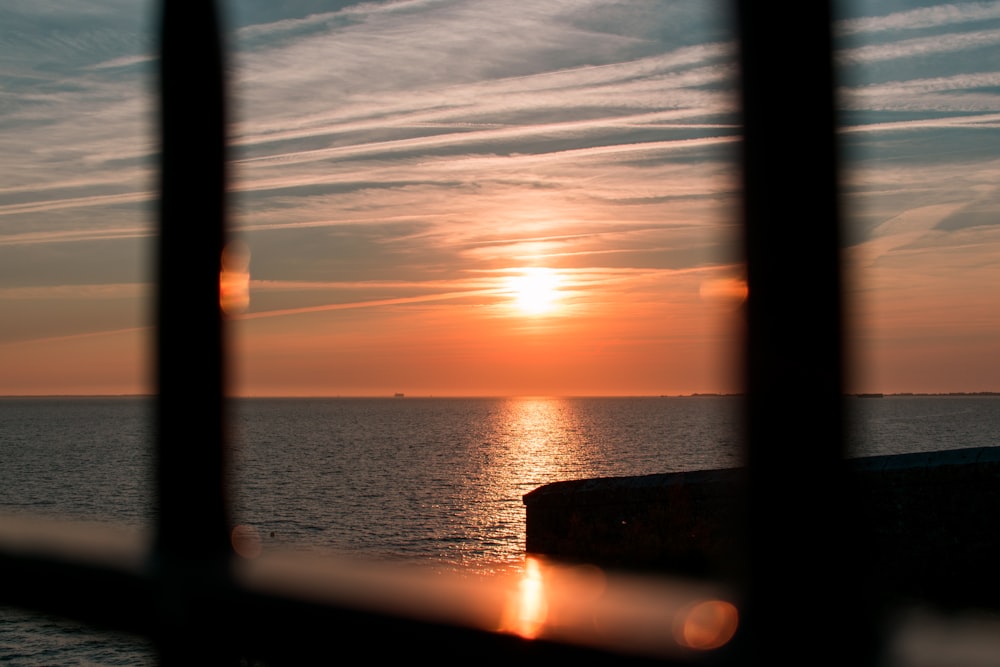 body of water during sunset