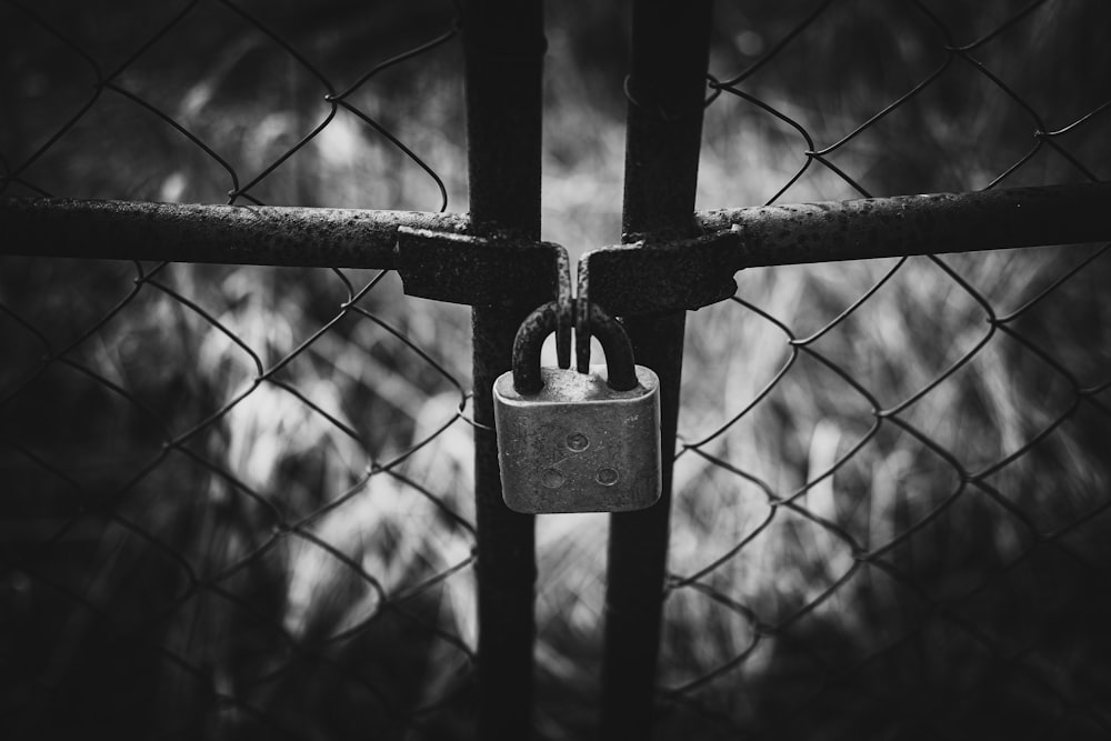 padlock on black metal fence