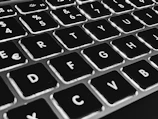 Close-up of a laptop keyboard with rounded keys and a minimalist design.