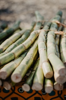 green bamboo sticks on brown wooden table