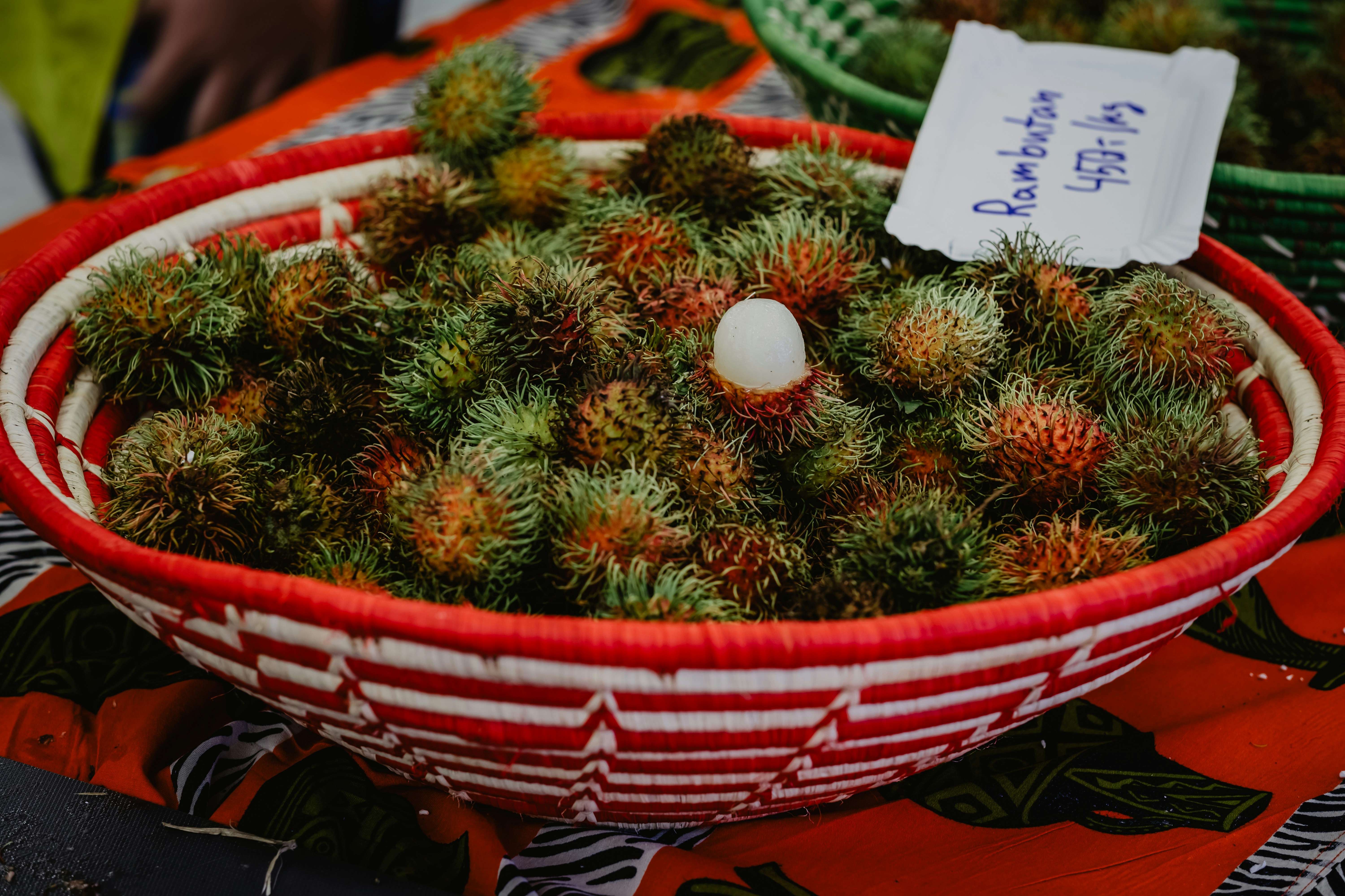 white and red flowers on red basket, 