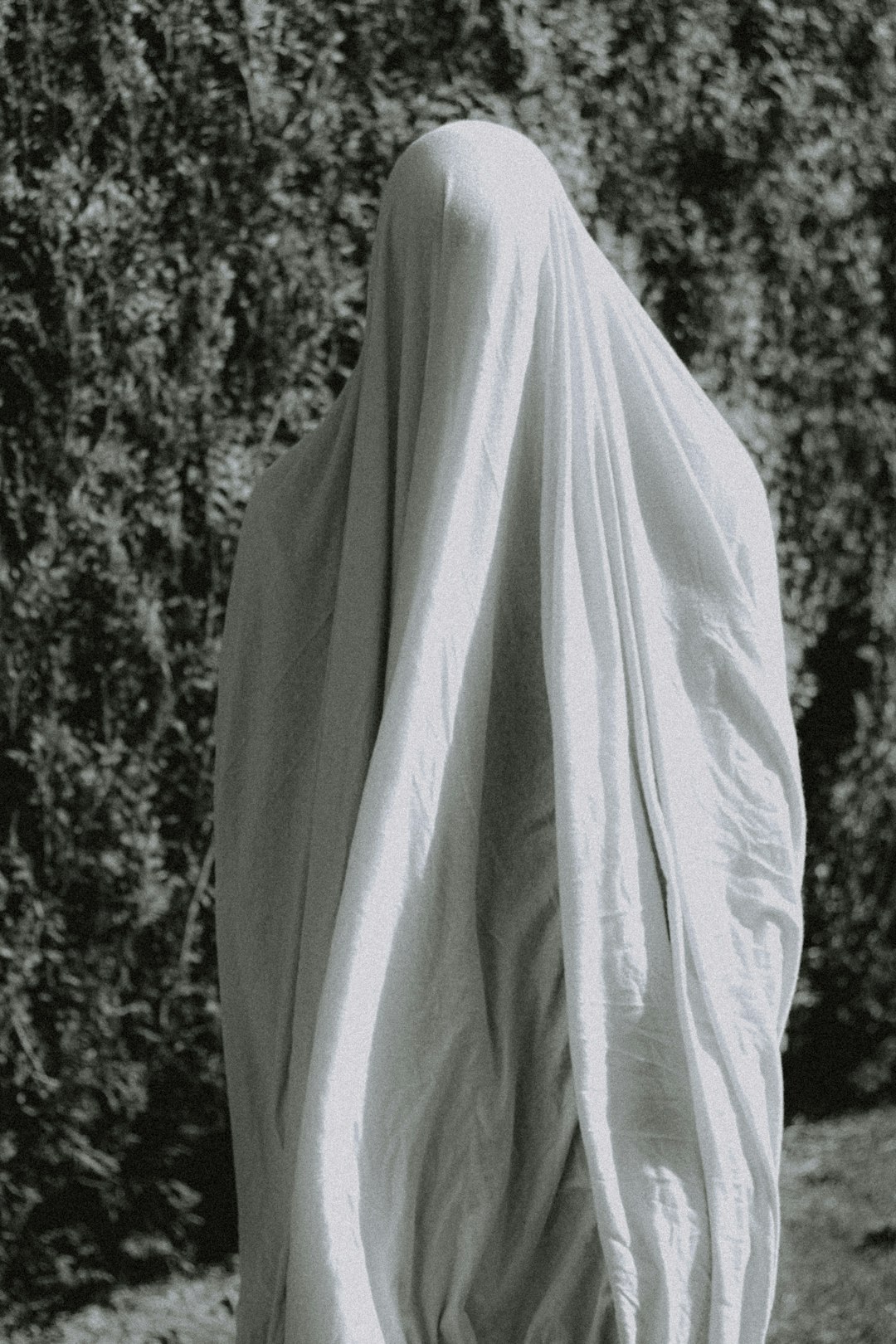 white textile on black and white surface