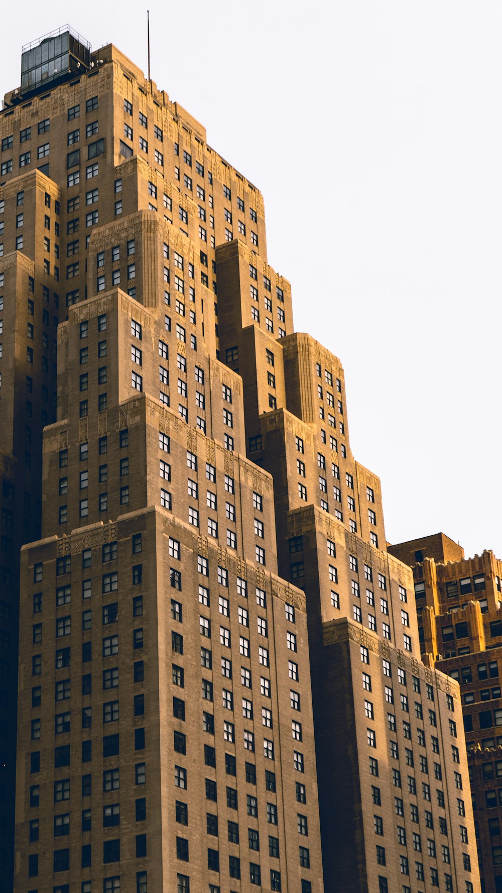 brown concrete building under white sky during daytime