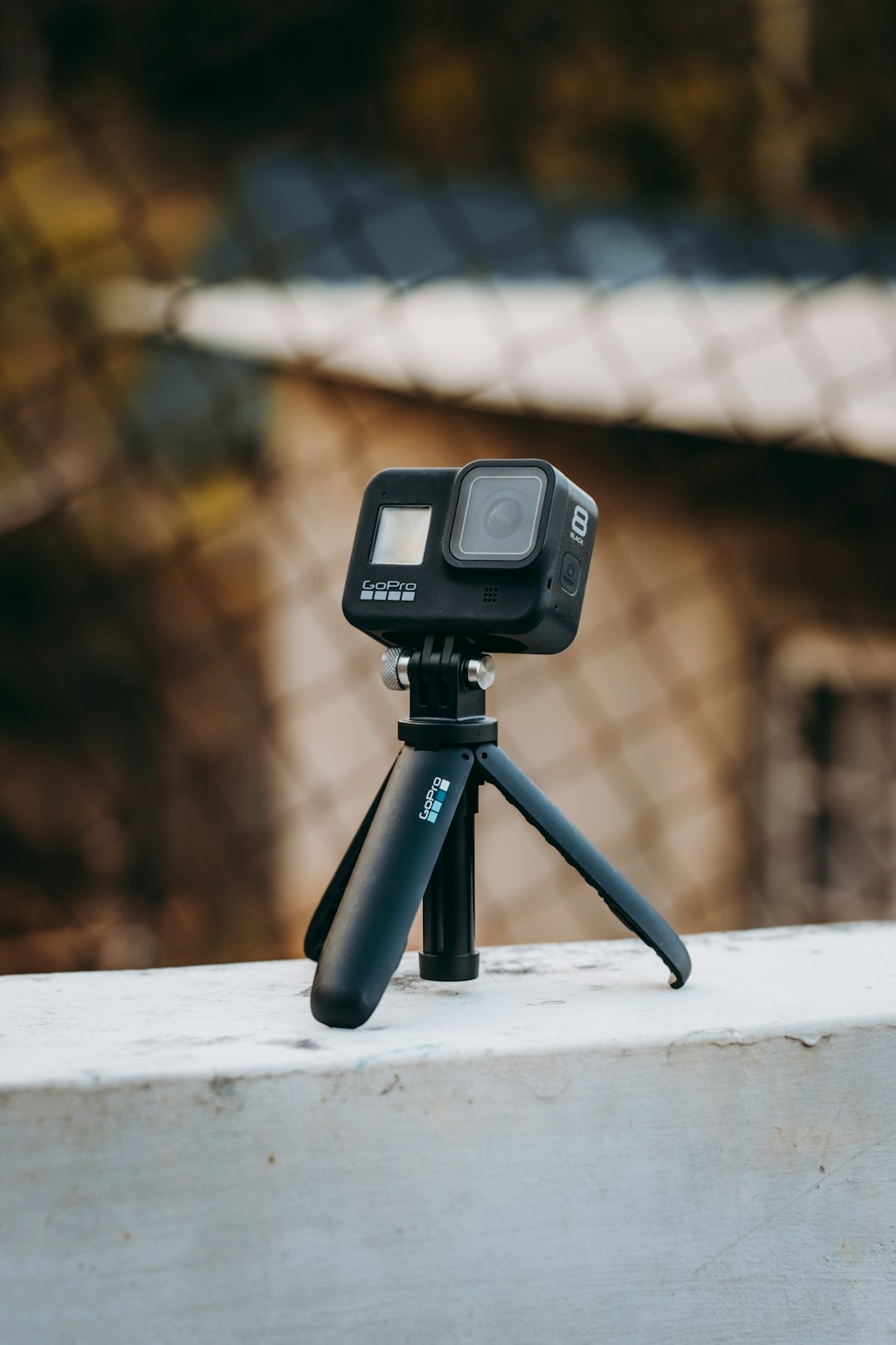 black camera on tripod in tilt shift lens