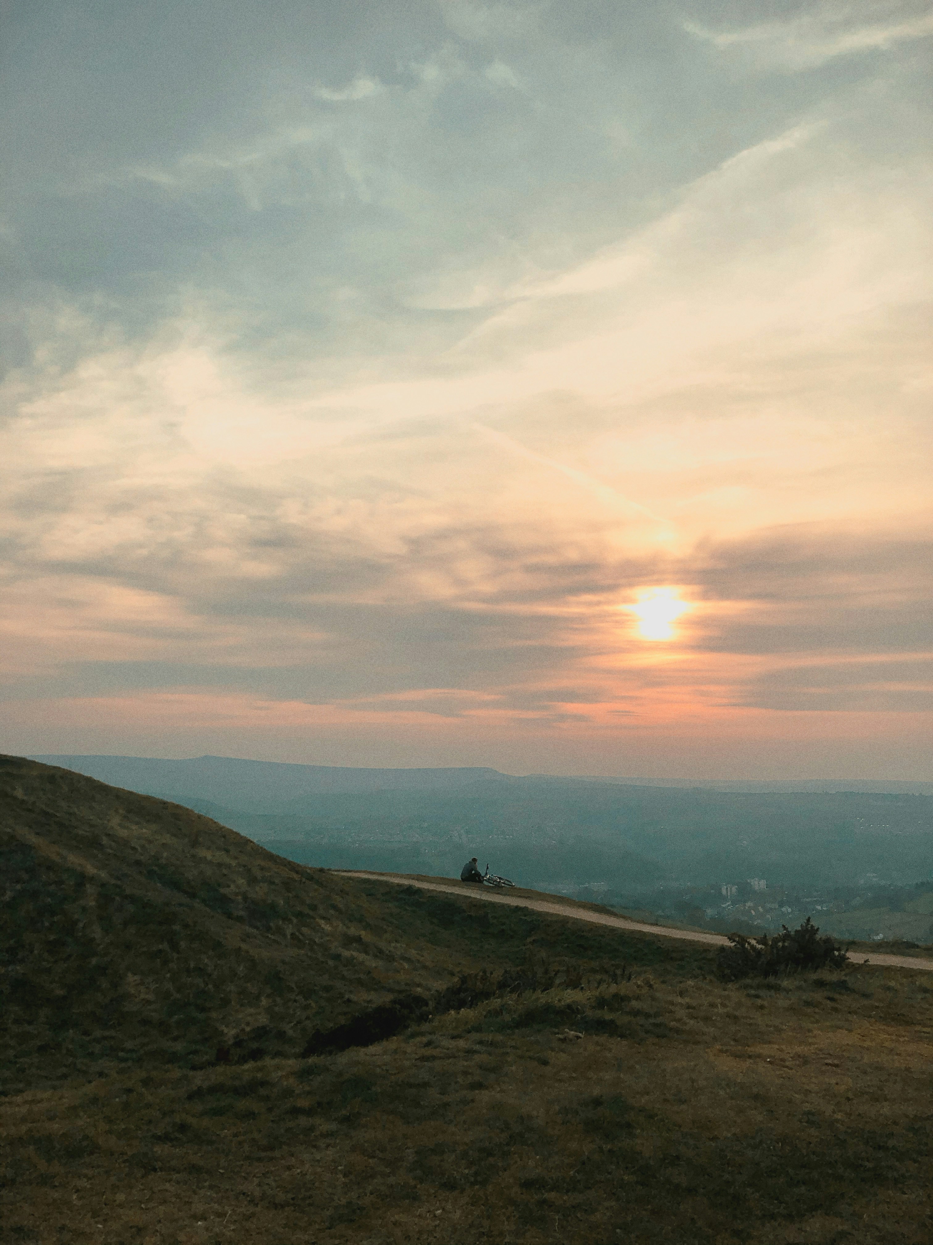 green grass field near body of water during daytime