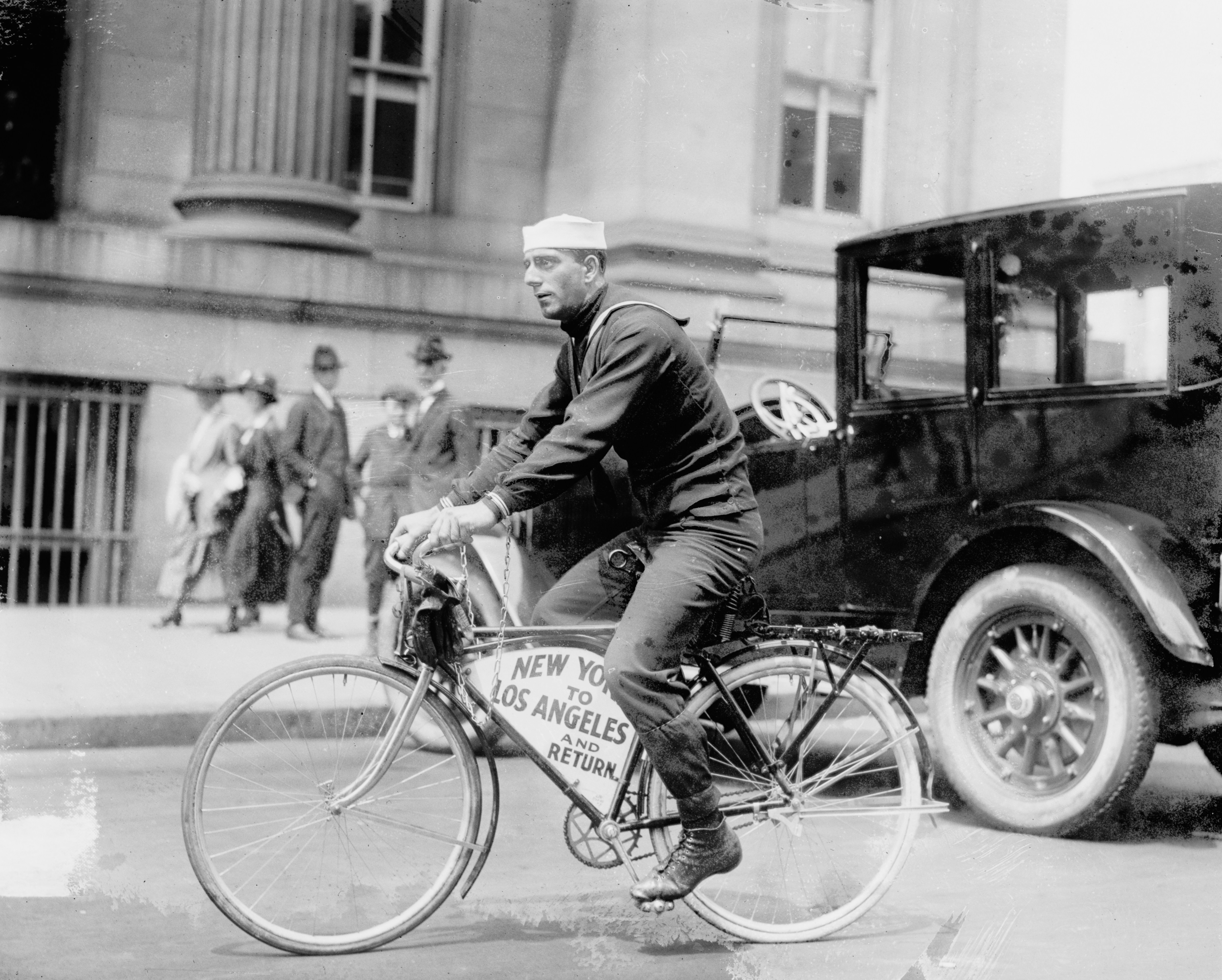Sailor Tony Pizzo on a bicycle