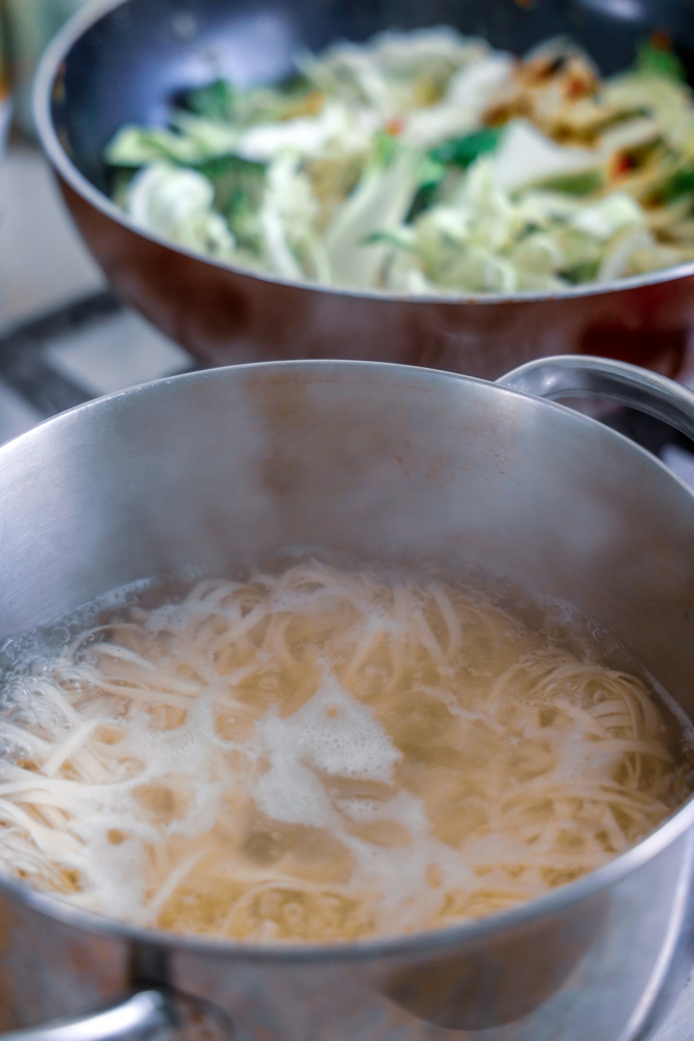 white noodles in stainless steel bowl