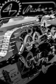 An intricate assembly of metallic gears and mechanical components with detailed reflections on a glossy surface. The scene includes circular cogs and patterns, suggesting a focus on machinery or a mechanical design project.