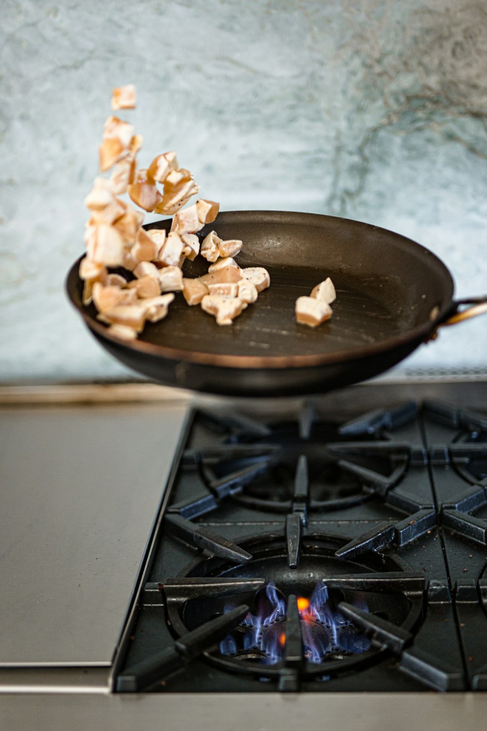 brown food on black frying pan