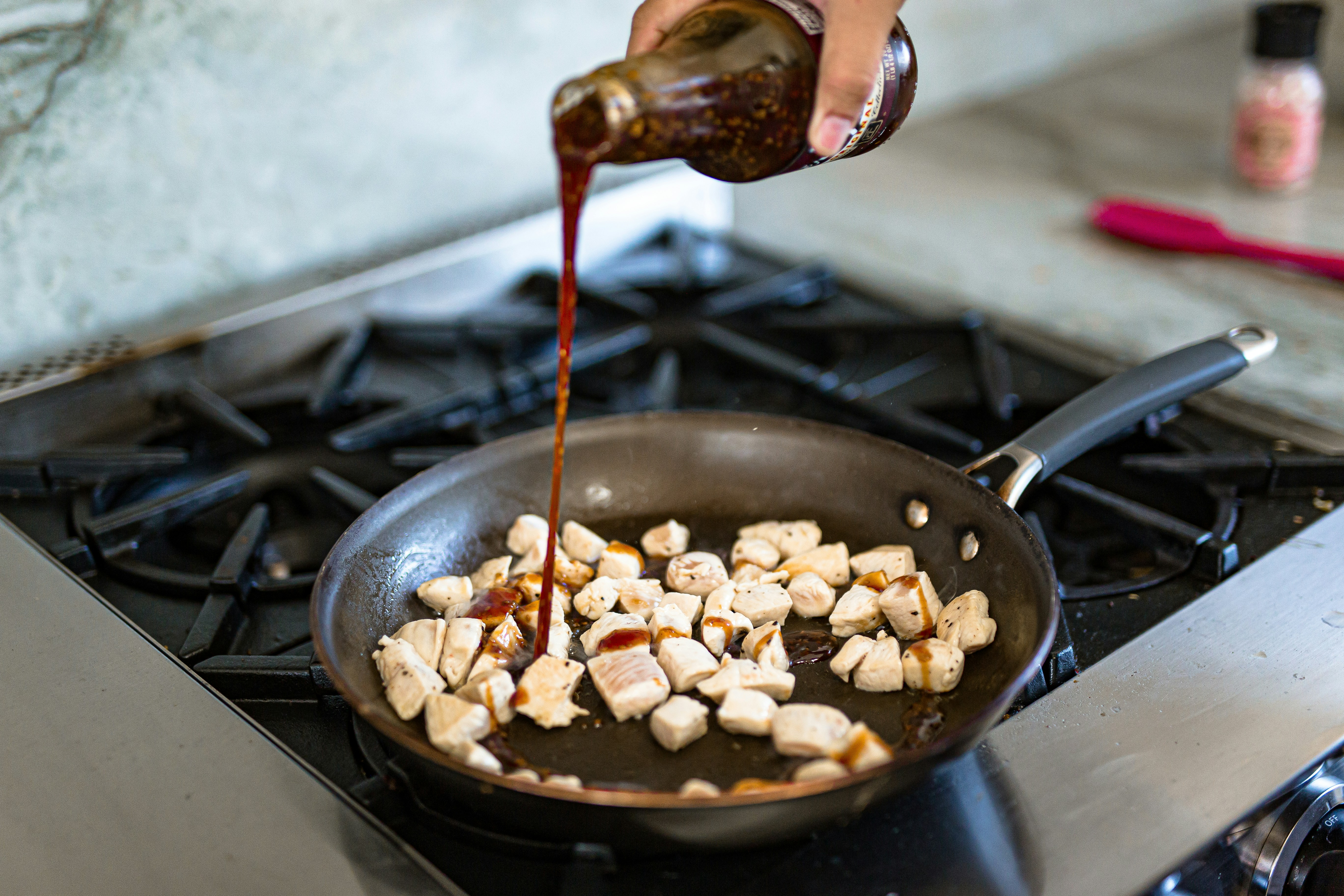 person cooking food on black pan