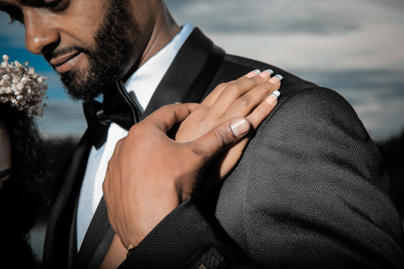 polished man in a black suit jacket