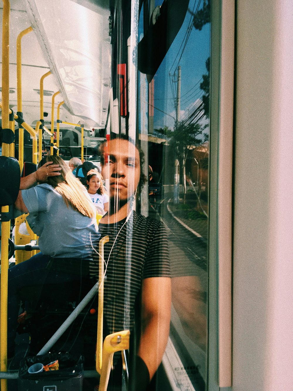 woman in white shirt sitting on train