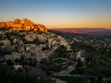 View from the window overlooking the historic village of Espalion at sunset.