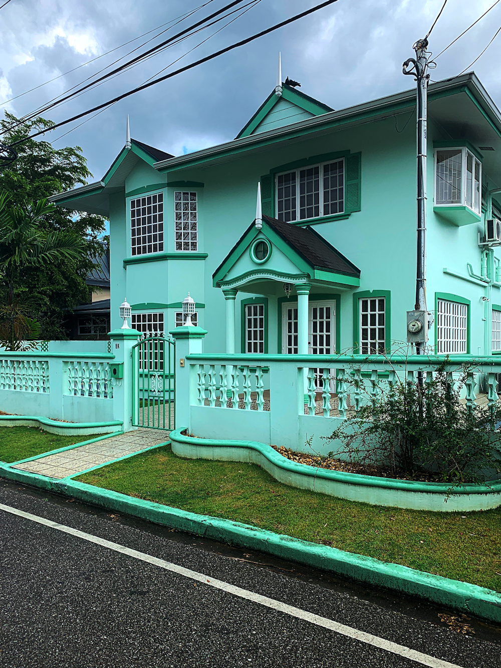 white and green 2 storey house