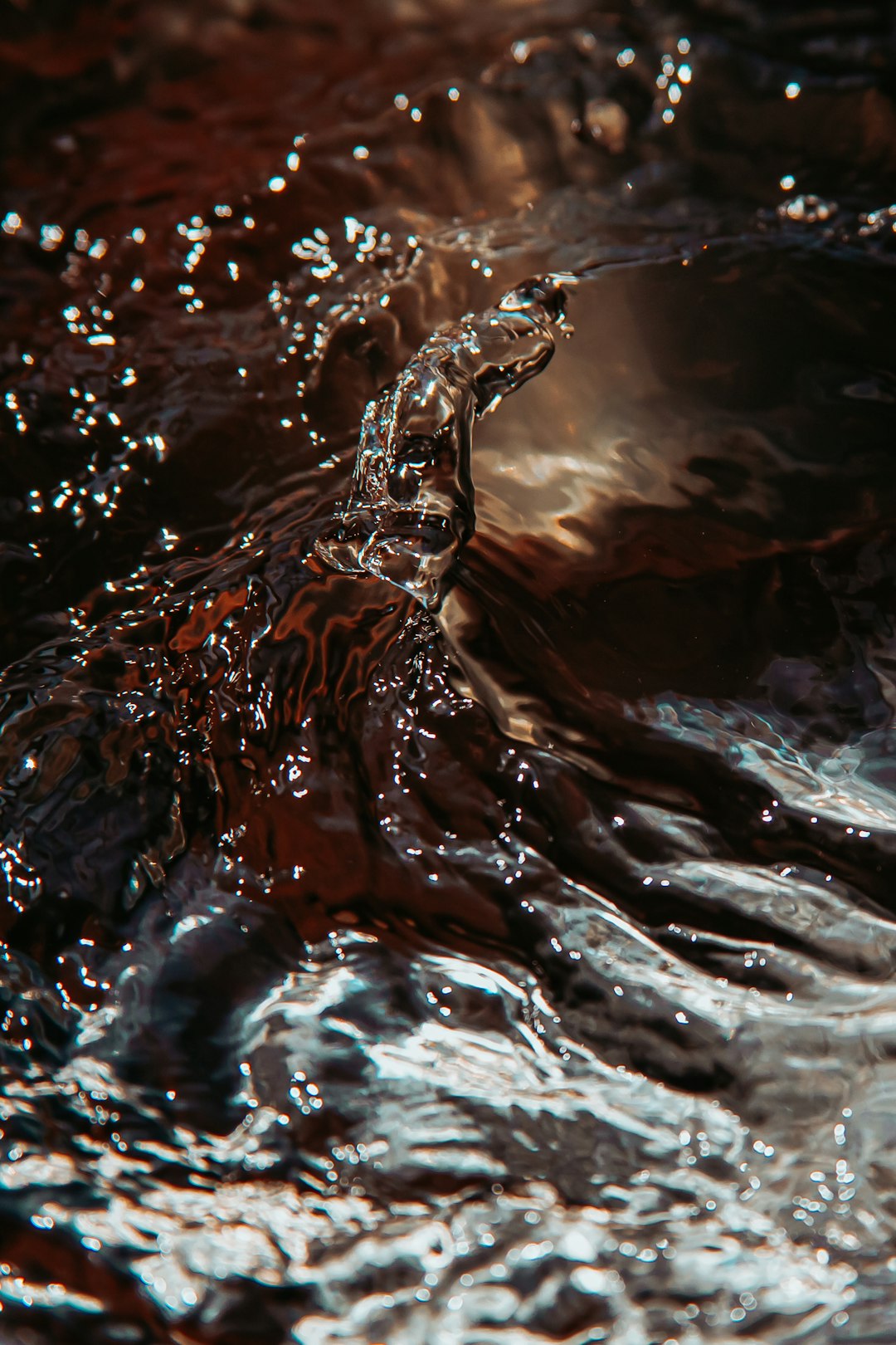 water splash on brown rock