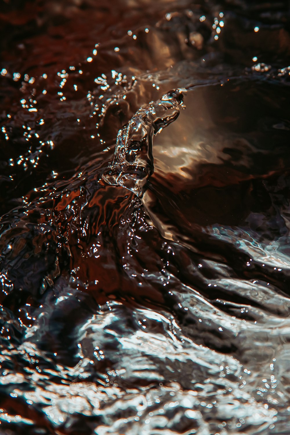 water splash on brown rock