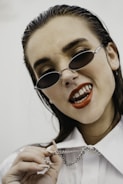 woman in white shirt wearing black sunglasses