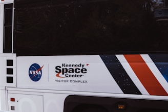 white and orange car showing license plate