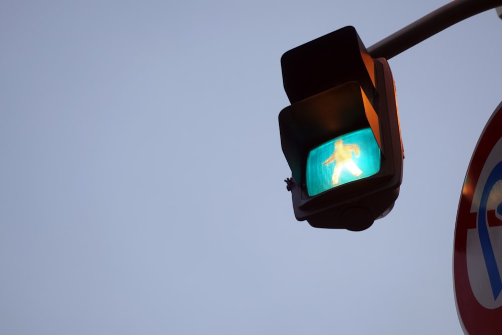 black traffic light turned on during night time