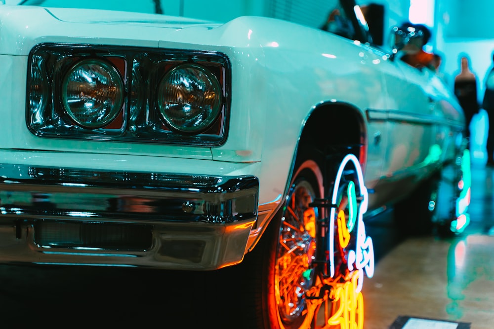 white car with orange and blue lights