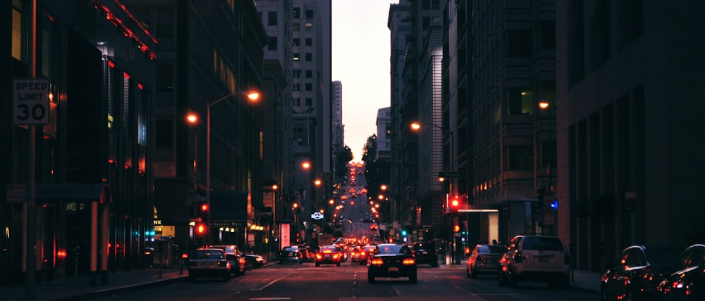 cars on road in city during night time