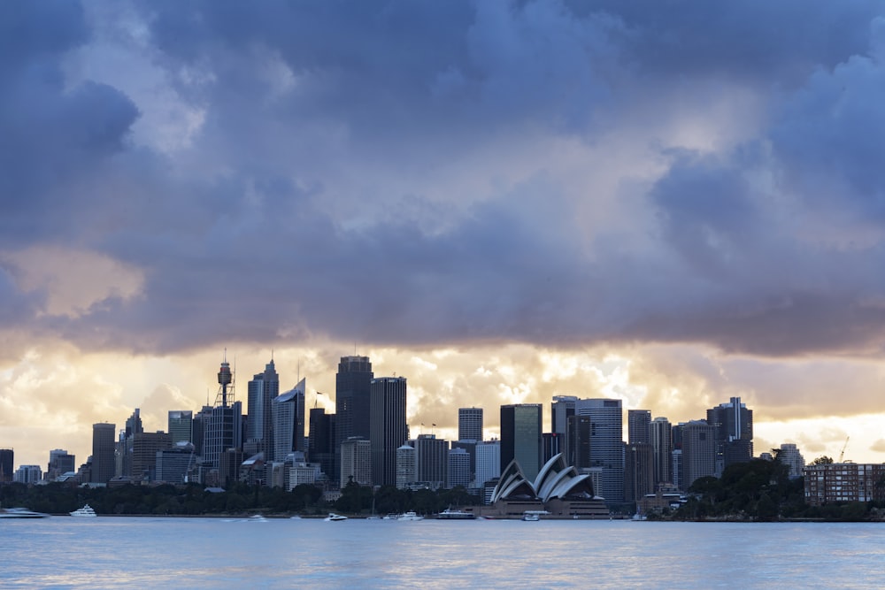 city skyline across body of water during daytime