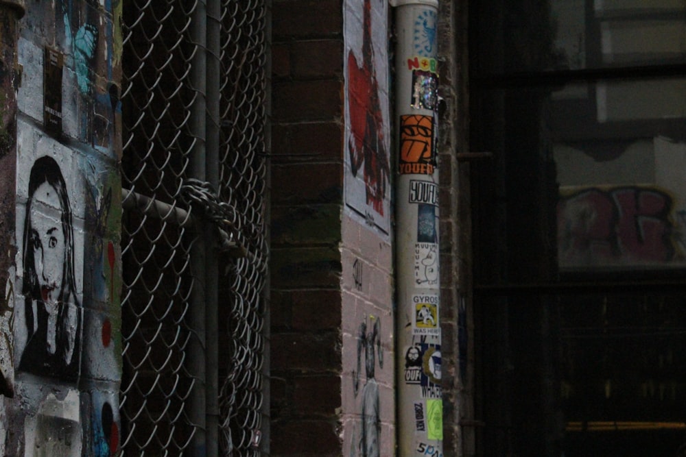 black metal fence near white and red wall