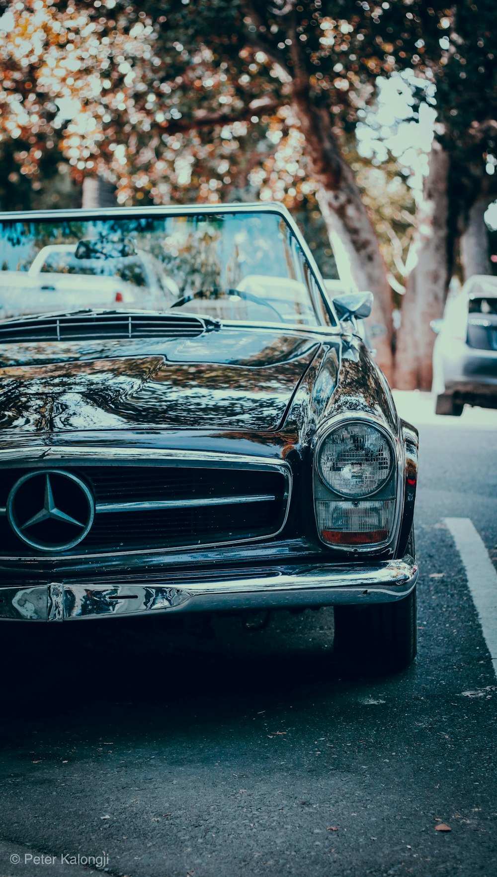 black mercedes benz car on road during daytime