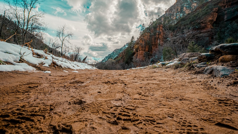 brown and gray rocky mountain under white cloudy sky during daytime