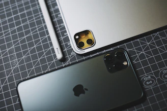 silver iphone 6s on silver macbook