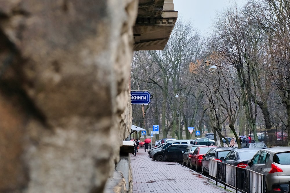 cars parked on sidewalk during daytime