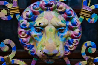 A 3D printed lion figurine with intricate details in shimmering purple and silver hues.