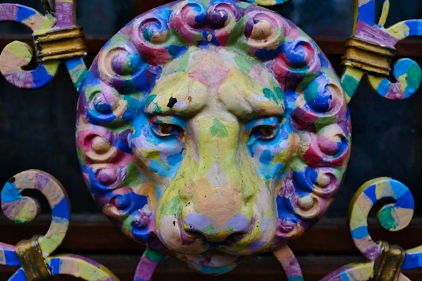 A 3D printed lion figurine with intricate details in shimmering purple and silver hues.